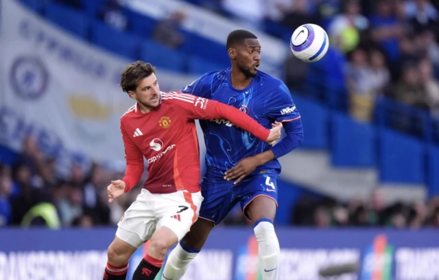 Manchester United's Mason Mount (left) and Chelsea's Tosin Adarabioyo battle for the ball