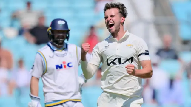Tom Lawes celebrates taking a wicket for Surrey against Yorkshire