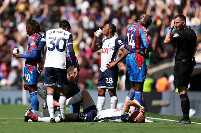 Dejan Kulusevski receiving treatment on a knee injury