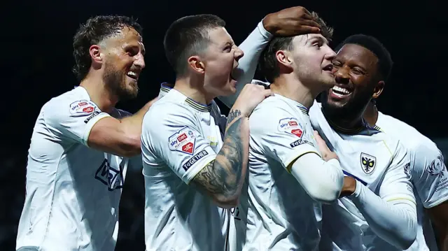 AFC Wimbledon celebrating scoring their goal at Notts County