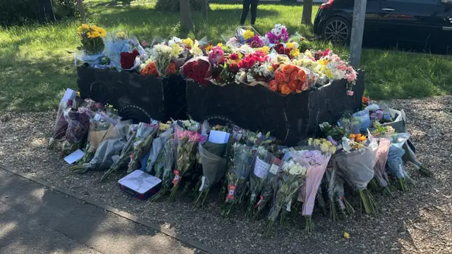 Bunches of flowers left outside fire station