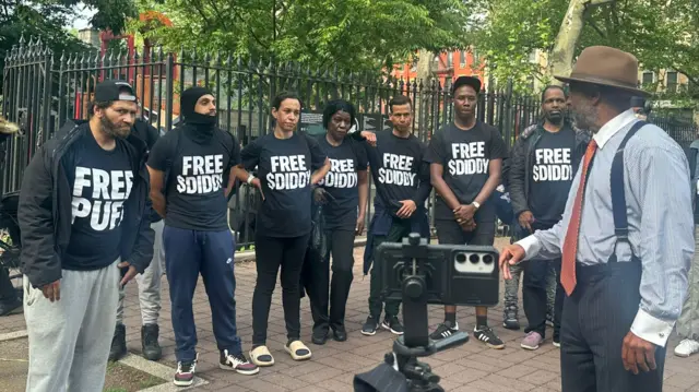 Diddy supporters line up outside of court