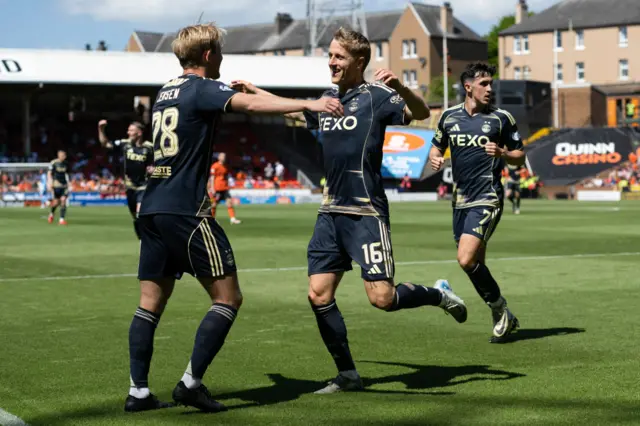 Aberdeen's Jeppe Okkels (centre) celebrates after scoring to make it 1-0 during a William Hill Premiership match between Dundee United and Aberdeen at the CalForth Construction Arena at Tannadice Park