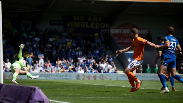 Alex Bass saves from Matty Stevens