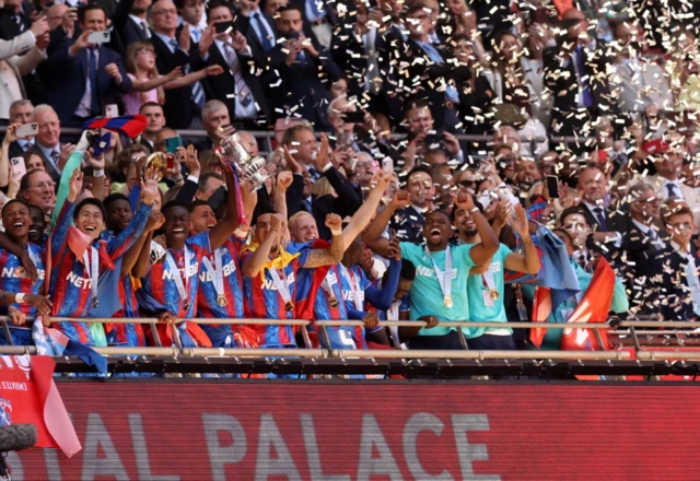 Crystal Palace's Marc Guehi and Joel Ward celebrate with the trophy after winning the FA Cup
