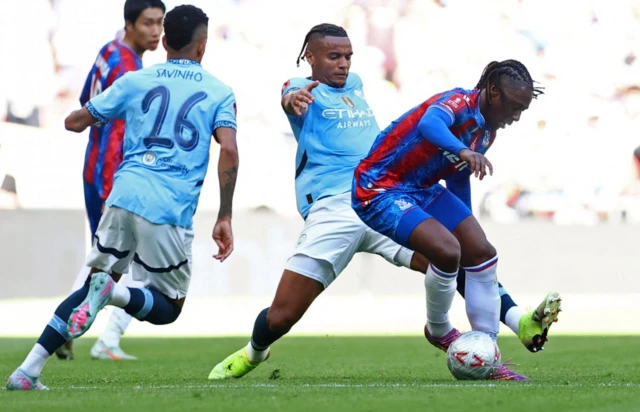 Manchester City's Manuel Akanji in action with Crystal Palace's Eberechi Eze