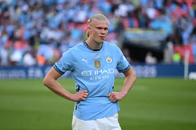 Erling Haaland of Manchester City looks dejected