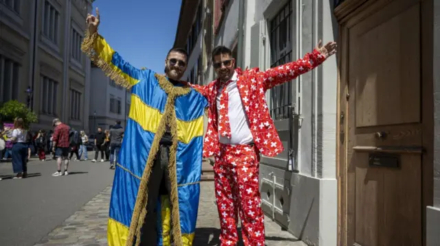 Alessandro (L) from Italy and Martino from Switzerland, supporting Swedish and Swiss contestants, in Basel
