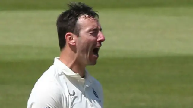 Middlesex's Toby Roland-Jones celebrates a wicket against Leicestershire