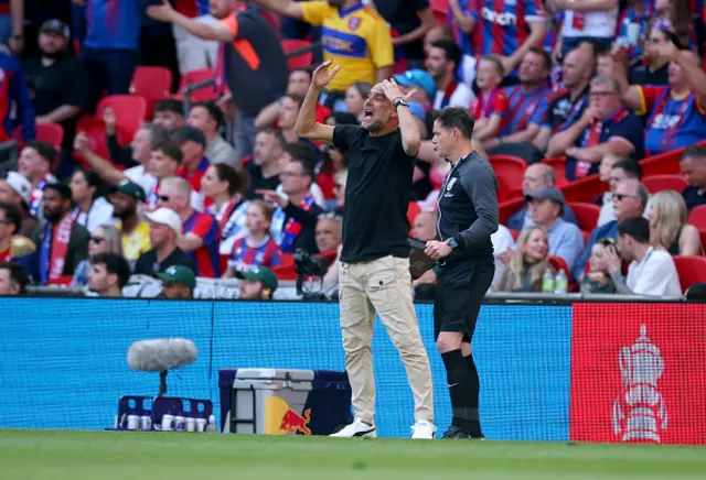 Pep Guardiola, Manager of Manchester City reacts