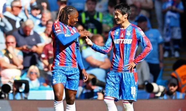 Crystal Palace's Eberechi Eze celebrates scoring their first goal with Daichi Kamada