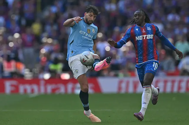 Ruben Dias (L) vies with Crystal Palace's English midfielder  Eberechi Eze