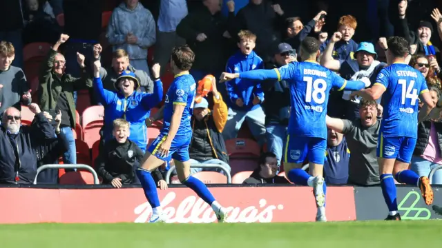 Sam Hutchinson celebrates at Grimsby