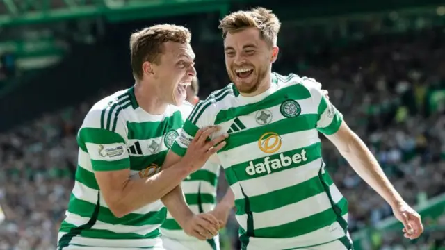 Celtic's Alistair Johnston and James Forrest celebrate