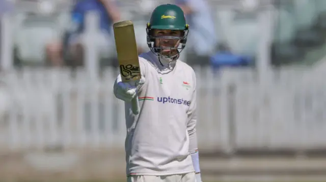 Peter Handscomb raises his bat after getting 50 for Leics at Lord's against Middlesex