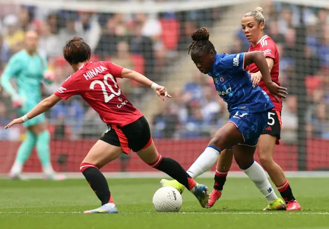 Chelsea's Sandy Baltimore in action with Manchester United's Hinata Miyazawa and Aoife Mannion