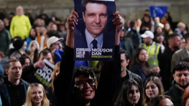 Supporters of Presidential candidate Nicusor Dan react, following exit polls of Romania's second round of the presidential election, in Bucharest, Romania, May 19, 2025