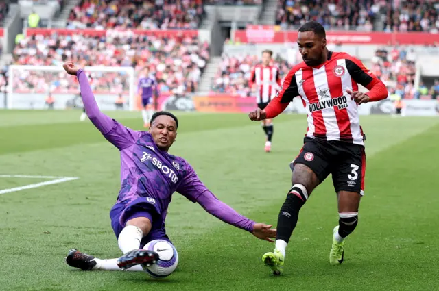 Fulham's Kenny Tete in action with Brentford's Rico Henry