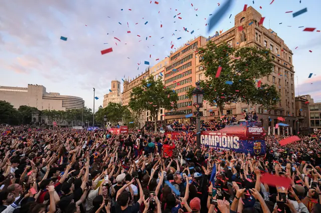 Barcelona parade their three trophies in front of their fans in the city centre