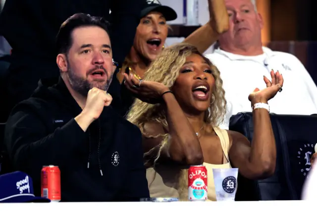 Serena Williams and her husband Alexis Ohanian cheer