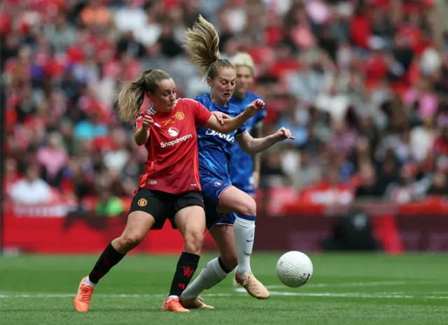 Manchester United's Ella Toone in action with Chelsea's Keira Walsh