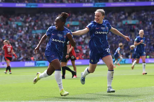 Sandy Baltimore celebrates after scoring from the spot