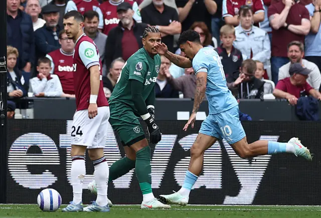 Nottingham Forest's English midfielder #10 Morgan Gibbs-White (R) celebrates scoring the opening goal