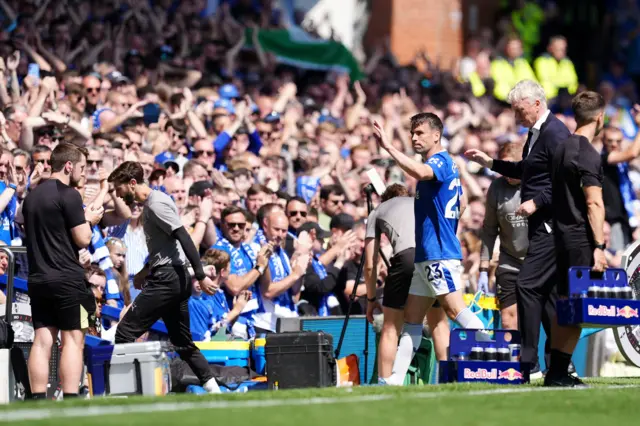 Everton's Seamus Coleman (centre) gestures to the crowd after leaving the pitch after going down injured during the Premier League match at Goodison Park, Liverpool.
