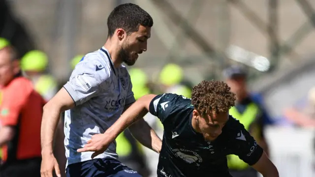 Dundee's Ziyad Larkeche and St Johnstone's Stephen Duke-McKenna