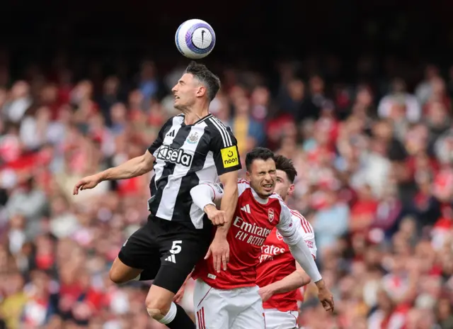 Newcastle United's Fabian Schar in action with Arsenal's Gabriel Martinelli