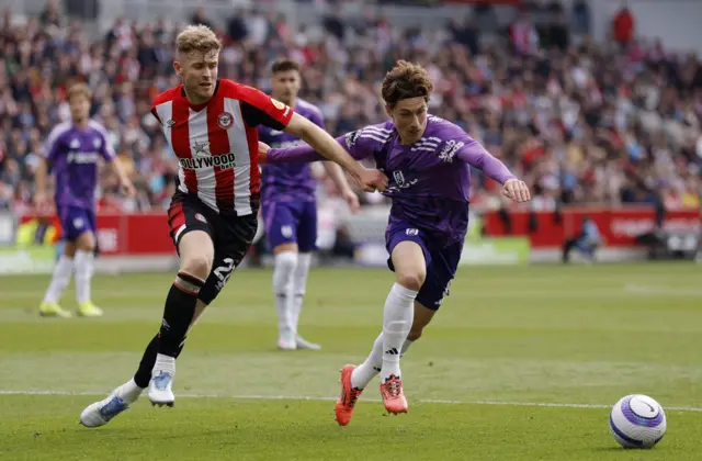 Brentford's Nathan Collins in action with Fulham's Harry Wilson