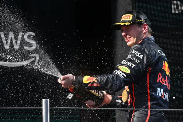 Max Verstappen sprays champagne on the Imola podium
