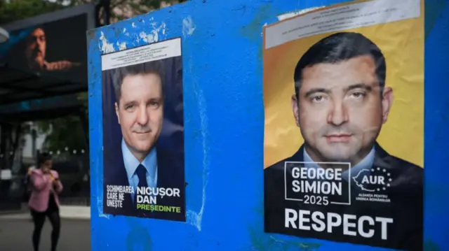A view of electoral posters featuring presidential candidates Nicusor Dan and George Simion