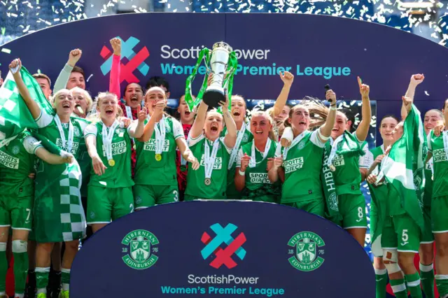 Hibs players lift SWPL trophy