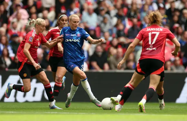 Manchester United's Millie Turner in action with Chelsea's Agnes Beever-Jones
