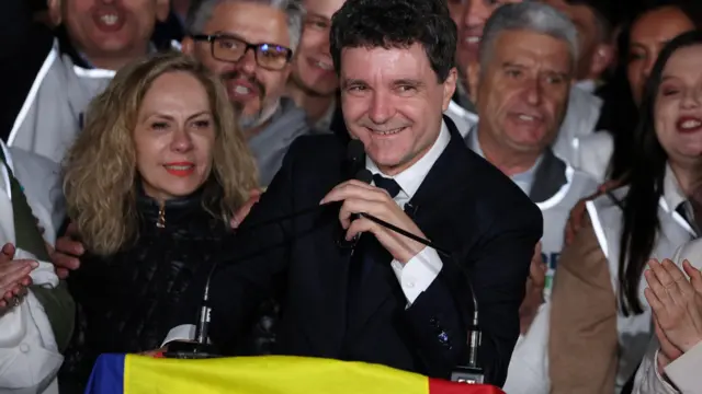 Presidential candidate Nicusor Dan speaks as he reacts to exit polls of Romania's second round of the presidential election, in Bucharest, Romania, May 18, 2025
