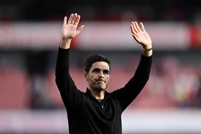 Mikel Arteta, Manager of Arsenal, acknowledges the fans