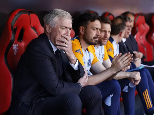 Carlo Ancelotti sits on the bench