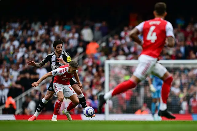 Leandro Trossard of Arsenal FC (19) and Sandro Tonali of Newcastle United FC (8) tussle for the ball during the Premier League match between Arsenal FC and Newcastle United FC at Emirates Stadium