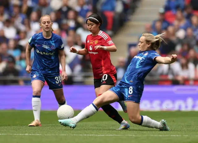 Manchester United's Hinata Miyazawa in action with Chelsea's Erin Cuthbert and Keira Walsh