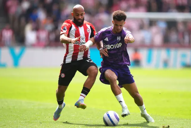 Brentford's Bryan Mbeumo (left) and Fulham's Antonee Robinson battle for the ball