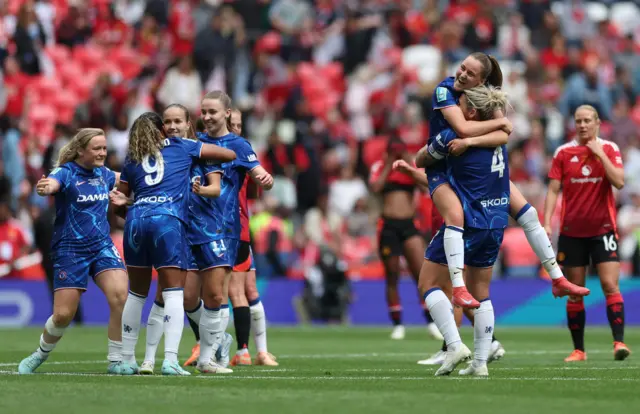Chelsea players celebrate at full-time