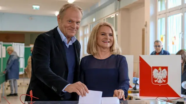Polish Prime Minister Donald Tusk and his wife Malgorzata vote during the first round of the presidential election, at a polling station in Sopot, Poland.