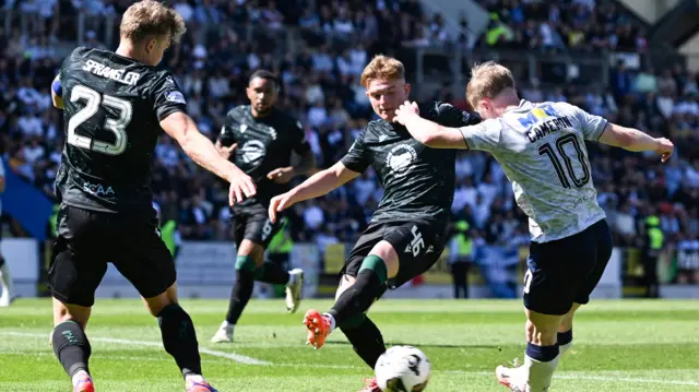 Lyall Cameron scores for Dundee against St Johnstone