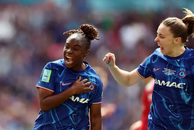 Chelsea's Sandy Baltimore celebrates scoring their first goal with Niamh Charles