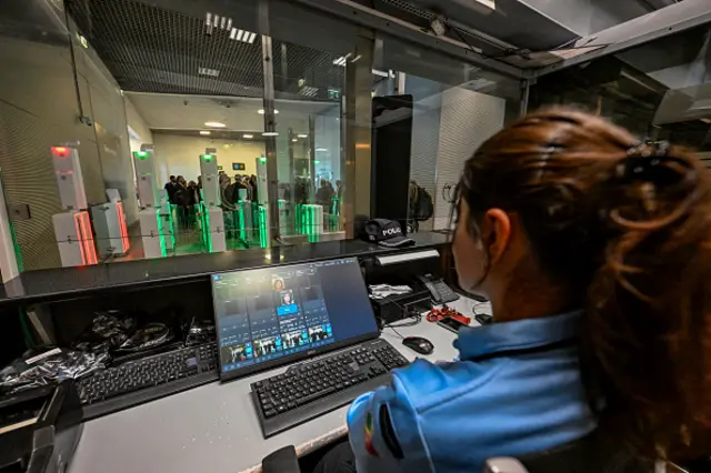 A police officer sits at a control booth supervising automated passport control machines for arriving passengers on the day the Minister for Internal Administration Margarida Blasco and the Minister for the Presidency António Leitão Amaro at Humberto Delgado Airport