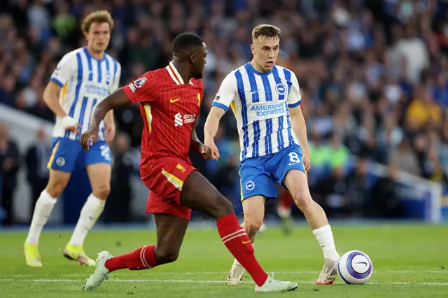 Brajan Gruda of Brighton & Hove Albion is challenged by Ibrahima Konate of Liverpool during the Premier League match between Brighton & Hove Albion FC and Liverpool FC at Amex Stadium on May 19, 2025 in Brighton, England.