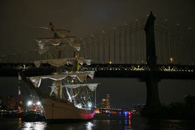A Mexican Navy training ship is seen near the Manhattan Bridge after it slammed into the nearby Brooklyn Bridge