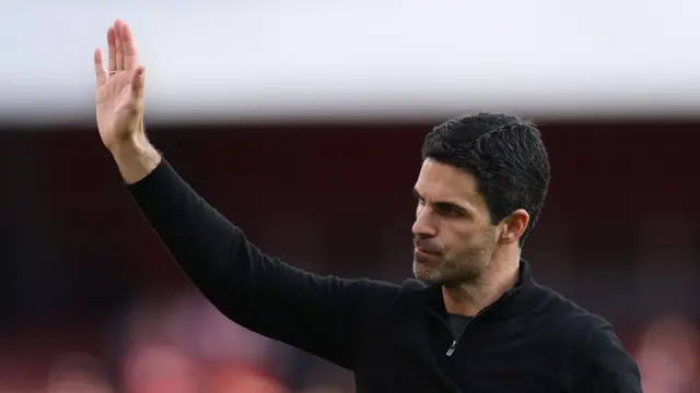Manager Mikel Arteta waves to the Arsenal fans after his team's win over Newcastle