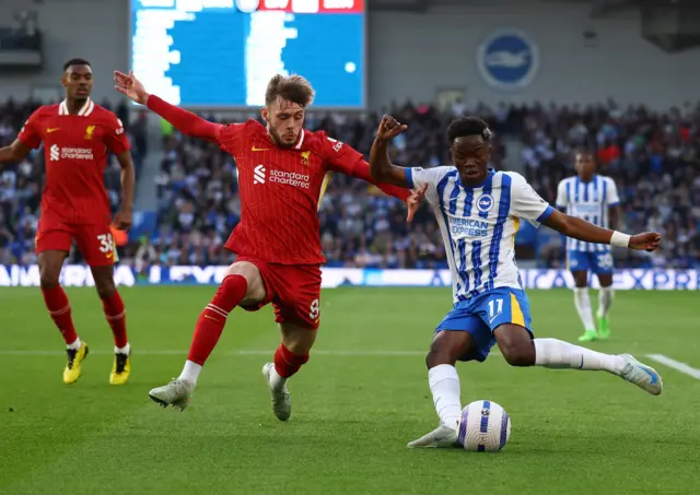 Liverpool's Conor Bradley in action with Brighton & Hove Albion's Simon Adingra